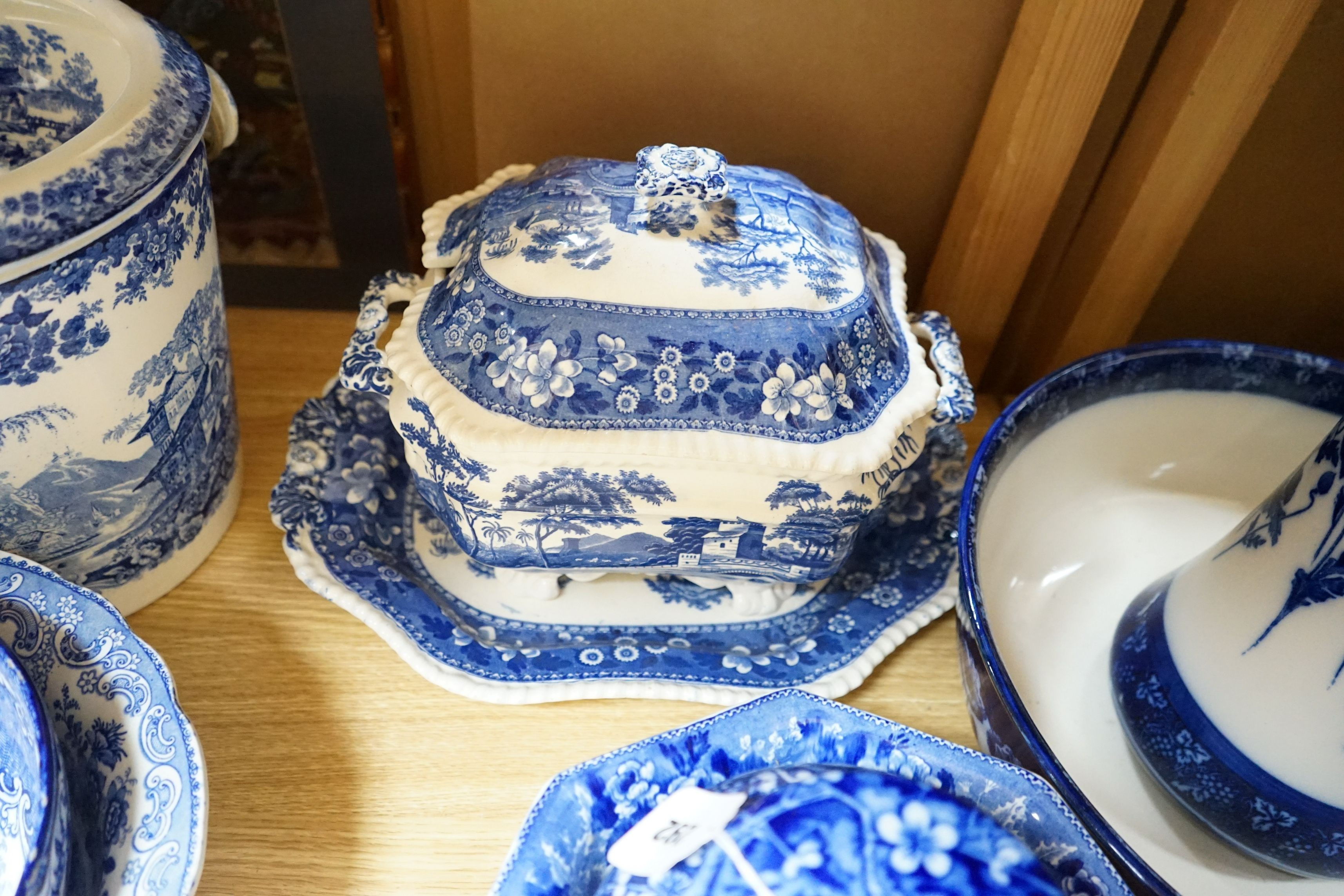 A blue and white jug and basin, tureen, cover and stand, slop pail, a jar and cover and three bowls